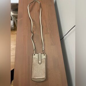 This is a gold sparkle cellphone crossbody handbag by A New Day.